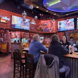 Texas Roadhouse - Picture of the bar area and the tree near the entrance.