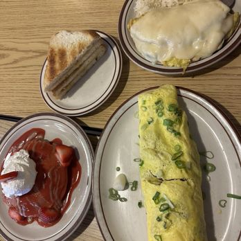 BabyStacks Cafe - Spring Mountain - Garden omelette with garlic fried rice and a side of sour dough. Lolo ricks adobo fried rice with a side of the strawberry guava pancakes - Breakfast & Brunch Near Me - Las Vegas, Nevada