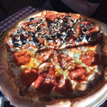Pizza a'fetta - Pepperoni pizza with the other half we added mushroom and olives - Pizza Near Me - Cannon Beach, Oregon Pizza a'fetta - Pepperoni pizza with the other half we added mushroom and olives - Pizza Near Me - Cannon Beach, Oregon