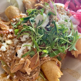Tito's Taquitos - a close up of a taquito dish - Tacos Near Me - Beaverton, Oregon Tito's Taquitos - a close up of a taquito dish - Tacos Near Me - Beaverton, Oregon