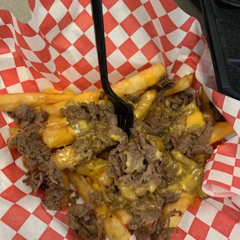 The Cheesesteak Joint - Close up of Philly cheesesteak fries - Food Trucks Near Me The Cheesesteak Joint - Close up of Philly cheesesteak fries - Food Trucks Near Me