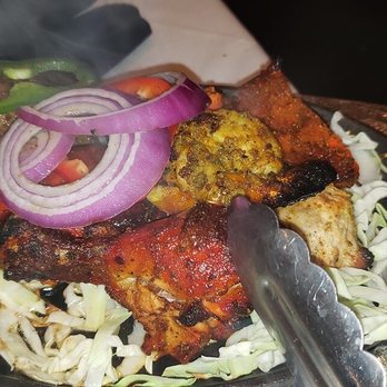Namaste - Tandoori Mixed Grill  Shrimp, lamb, and chicken grilled in the tandoori oven. It's comes out piping hot on a sizzled plate and rice! - Indian Near Me - Gambrills, Maryland
