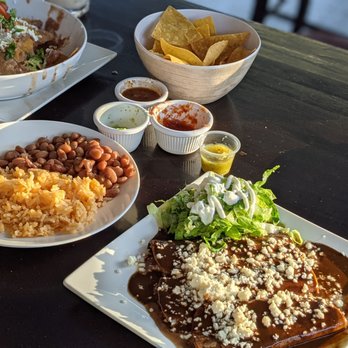 Flavia’s - Mole enchiladas, nachos and a side of rice and beans. Salsa roja, Verde, and birria... - Bagels Near Me - Cloverdale, California Flavia’s - Mole enchiladas, nachos and a side of rice and beans. Salsa roja, Verde, and birria... - Bagels Near Me - Cloverdale, California