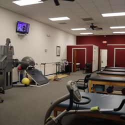 Carolina Physical Therapy and Sports Medicine - Fully equipped physical therapy workout area in Red Banks, SC, featuring specialized treatment for knee, shoulder, spine, and foot injuries.