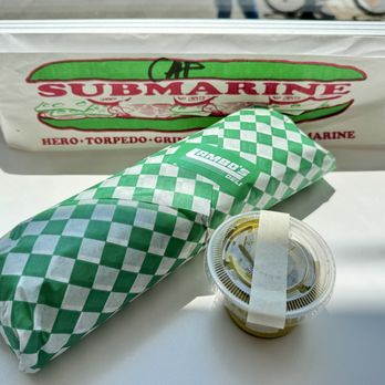 Lambo's Deli - Classic sandwich paper w/ pickles on the side - Delis Near Me - Toronto, Ontario