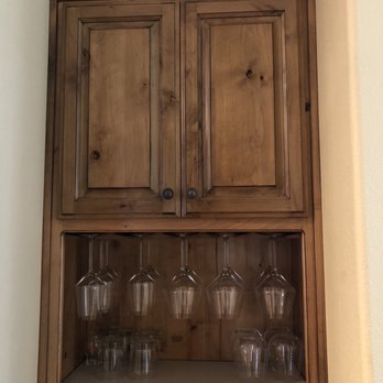 Makers Woodworks - Custom built cabinet top portion had a wine rack. It was removed doors, shelf and wine glass racks added. - Cabinetry Near Me