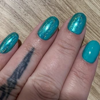 That Colour Nails - Dublin Green with a turquoise chrome finish. You can see the one finger that the chrome didn't stay on. - Nail Salons Near Me - Chicago, Illinois