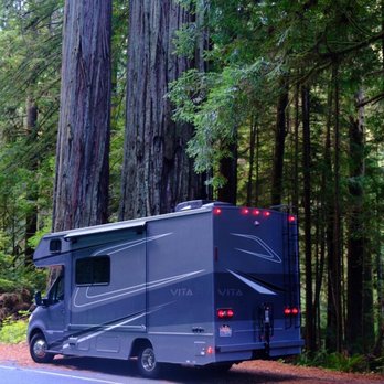 Live2RV - RV parked next to a massive redwood tree in Redwoods National Park - RV Rental Near Me - Concord, California Live2RV - RV parked next to a massive redwood tree in Redwoods National Park - RV Rental Near Me - Concord, California