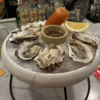 Ramie - Oysters on a shell - Wine Bars Near Me - Seattle, Washington Ramie - Oysters on a shell - Wine Bars Near Me - Seattle, Washington