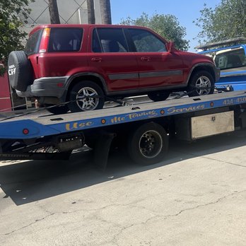 Use Me Towing Services - Flatbed Tow Truck - Towing Near Me