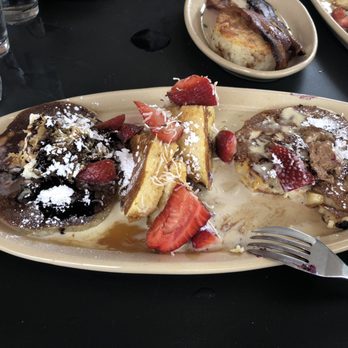 Snooze, an A.M. Eatery - Coco-Nana Cake on left, OMG! French Toast in the middle and Pineapple Upside Down Pancake on the right. - Breakfast & Brunch Near Me - Katy, Texas Snooze, an A.M. Eatery - Coco-Nana Cake on left, OMG! French Toast in the middle and Pineapple Upside Down Pancake on the right. - Breakfast & Brunch Near Me - Katy, Texas