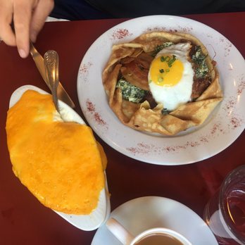 Cafe Conti - Cheese grits and cream spinach bacon crepes - Breakfast & Brunch Near Me - New Orleans, Louisiana Cafe Conti - Cheese grits and cream spinach bacon crepes - Breakfast & Brunch Near Me - New Orleans, Louisiana