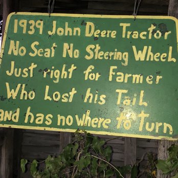 The Red Barn - a green sign that says john deer tractor no seat no steering wheel just right of farmer who lost his faith and has - American Near Me - Demopolis, Alabama The Red Barn - a green sign that says john deer tractor no seat no steering wheel just right of farmer who lost his faith and has - American Near Me - Demopolis, Alabama