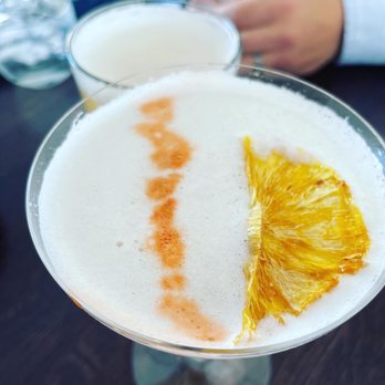 Nola's - a close up of a drink in a martini glass - New American Near Me - Clinton, New York