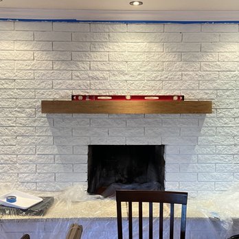 Art’s Remodeling - Floating shelve to Make sure it's level. - Handyman Near Me