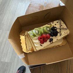 Albertsons - The cake was not laying flat on the box it was too big for the box.