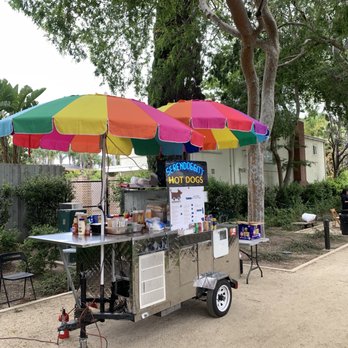 Serendoggity - a hot dog cart with colorful umbrellas - Hot Dogs Near Me Serendoggity - a hot dog cart with colorful umbrellas - Hot Dogs Near Me