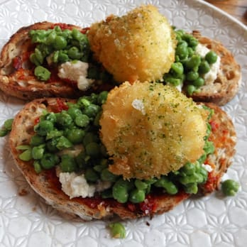 Two Birds Cafe - Sambal kaffir poached eggs with goats cheese and peas - Coffee & Tea Near Me - Collingwood, VIC