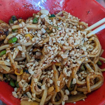 Genghis Grill - a red bowl of food with chopsticks - Mongolian Near Me - McKinney, Texas