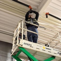 US Fire Protection - Our Pipefitter assembling fire sprinkler pipe branch under an I beam