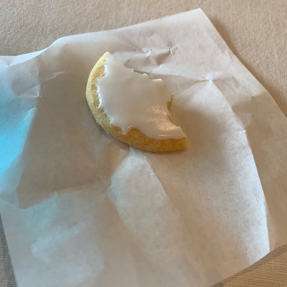 A partially eaten lemon cookie because I forgot to take a picture of it before I sank my teeth into the goodness