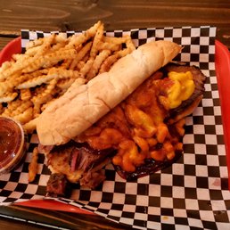 The Brisket sandwich with Mac and Cheese and a side of fries. The Brisket sandwich with Mac and Cheese and a side of fries.