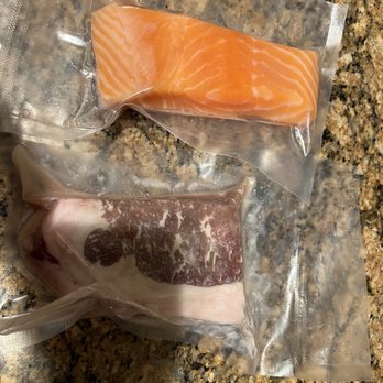 Pagu - Single servings of meat salmon - with no marinade or anything, just a couple of orange slices in a plastic box - Japanese Near Me - Cambridge, Massachusetts
