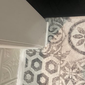 Atkins Custom Floor Covering - A large gap around the trim filled with caulking. - Carpeting Near Me - Du Quoin, Illinois Atkins Custom Floor Covering - A large gap around the trim filled with caulking. - Carpeting Near Me - Du Quoin, Illinois