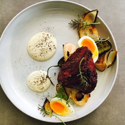 Vaquero Dining - Charred corned beef cheek, onion, pickled cucumber and celeriac puree.