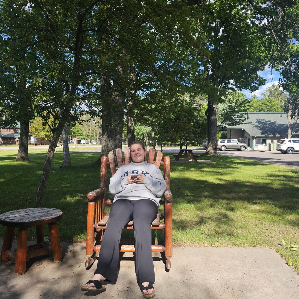 Rustic Manor Motor Lodge - My niece enjoying the wooden furniture! - Hotels Near Me - Saint Germain, Wisconsin Rustic Manor Motor Lodge - My niece enjoying the wooden furniture! - Hotels Near Me - Saint Germain, Wisconsin