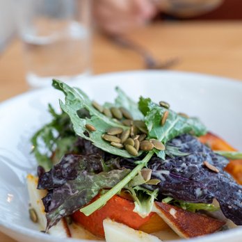 Restaurant 62 - a plate of salad with greens and tomatoes - French Near Me - Abbotsford, British Columbia