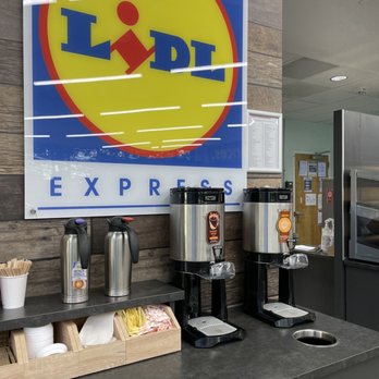 Lidl - a coffee station with a sign above it - Grocery Near Me - Arlington, Virginia