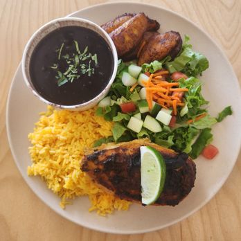 Black Bean Deli - Baked chicken plate- chicken over rice, beans, salad with avocado vinaigrette, and sweet plantains - Cuban Near Me - Winter Park, Florida Black Bean Deli - Baked chicken plate- chicken over rice, beans, salad with avocado vinaigrette, and sweet plantains - Cuban Near Me - Winter Park, Florida