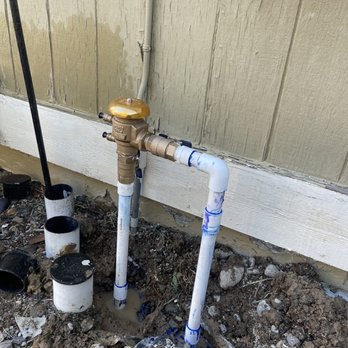 Forever Green Lawn Services - a pipe and a water meter - Lawn Services Near Me Forever Green Lawn Services - a pipe and a water meter - Lawn Services Near Me