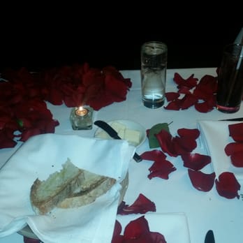 Meet The Meat - Rose petals on table - Steakhouses Near Me - Astoria, New York Meet The Meat - Rose petals on table - Steakhouses Near Me - Astoria, New York