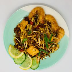 Normah's - NORMAHS MEE GORENG  KING PRAWN  Stir-fried noodle with King prawn or chicken, egg, fishball, tofu, bean sprout and choy sum (Contain nut)