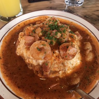 Denver Biscuit Co. - Broadway - Shrimp and grits (just a little bit of grits in a little hole in the biscuit but yummier than it looks) - Breakfast & Brunch Near Me - Denver, Colorado