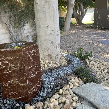 Landscape & Maintenance - The photo doesn't do it justice, and the rock feature stretches almost the length of the yard.  Gorgeous work. - Landscaping Near Me