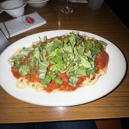 Fettuccini with meat sauce add basil