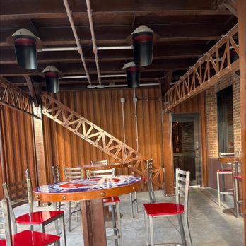 Shindigs Bar & Grill - red chairs and tables - American Near Me - Winfield, Kansas