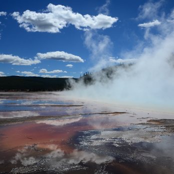 Grand Prismatic Spring - Steam rises off the Grand Prismatic Spring. - Landmarks & Historical Buildings Near Me Grand Prismatic Spring - Steam rises off the Grand Prismatic Spring. - Landmarks & Historical Buildings Near Me