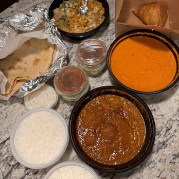 Mild 2 Spicy - The delivery order. Packed very well. Nothing leaked. Taste? Read my review. Tossed it all in the end. - Indian Near Me - Chicago, Illinois