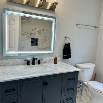 Times Construction - a bathroom with a vanity and toilet - General Contractors Near Me