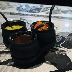 Black Salt Indian Bar & Restaurant - Tamarind sauce, spicy green sauce and mixed pickles