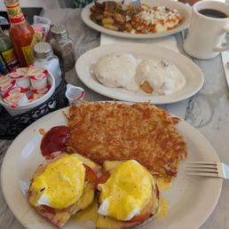 Eggs Benedict, hash browns and biscuits and gravy Eggs Benedict, hash browns and biscuits and gravy