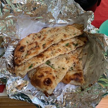 Satkar Indian Cuisine - Garlic naan - 4 huge slices - Indian Near Me - Sunnyvale, California Satkar Indian Cuisine - Garlic naan - 4 huge slices - Indian Near Me - Sunnyvale, California
