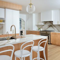 Monaco Interiors - This complete home reno baosts stunning arches, oak and white shaker cabinetry, white oak flooring and stunning gold accents. A true dream.