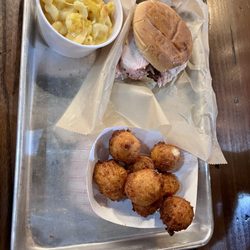 Chicken sandwich with mac & cheese and hush puppies.