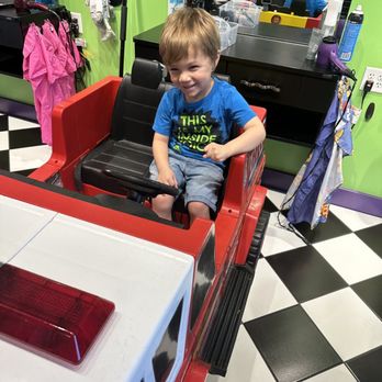 Sharkey's Cuts for Kids - Sitting in the fire truck at Sharkeys! - Kids Hair Salons Near Me - Omaha, Nebraska Sharkey's Cuts for Kids - Sitting in the fire truck at Sharkeys! - Kids Hair Salons Near Me - Omaha, Nebraska