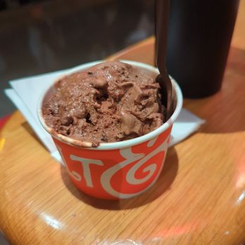 Salt & Straw - Hazelnut Chocolate Cookies & Cream single scoop, with a few bites taken out so it doesn't melt over the side - Desserts Near Me - Palo Alto, California Salt & Straw - Hazelnut Chocolate Cookies & Cream single scoop, with a few bites taken out so it doesn't melt over the side - Desserts Near Me - Palo Alto, California